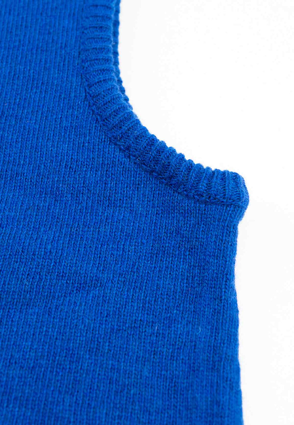 Close up of the brim of a knit hood in cobalt blue.