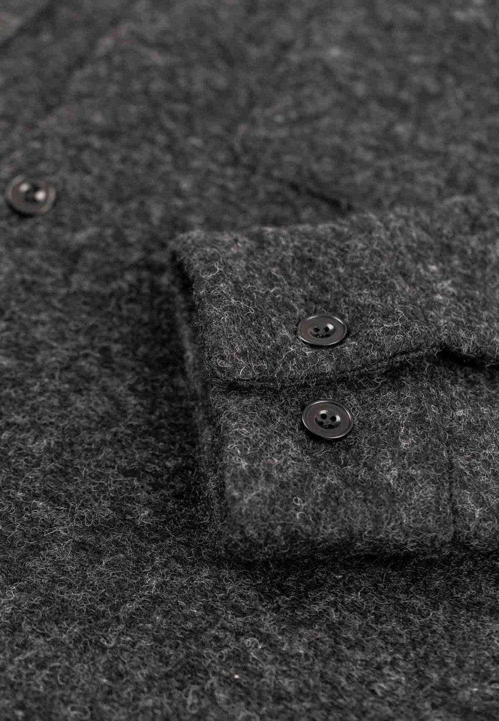 Close up of the cuff of a relaxed overshirt in anthracite.